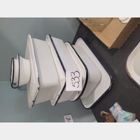 Stack of porcelain storage containers and serving tray