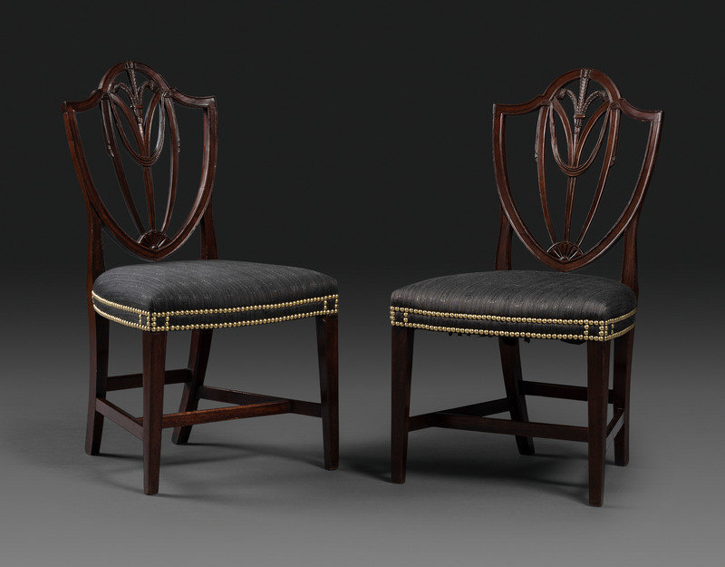 A Pair of Federal Carved Mahogany Shield-Back Dining Chairs