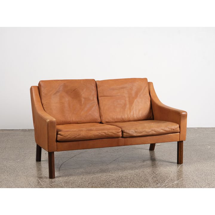 Rud Thygesen - A 1960s Danish two-seater leather sofa
