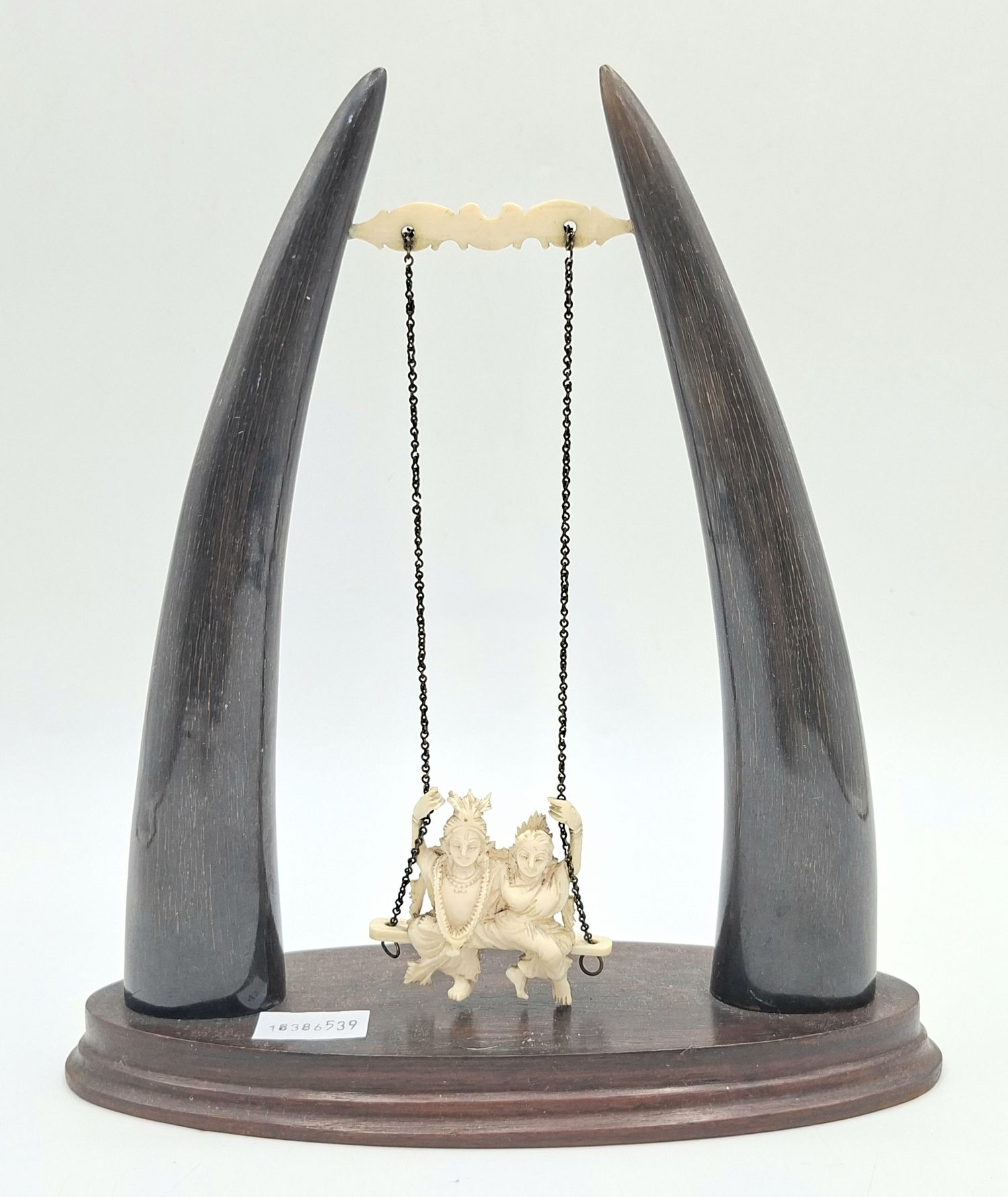 28 · A CARVED IVORY AND HORN ORNAMENT