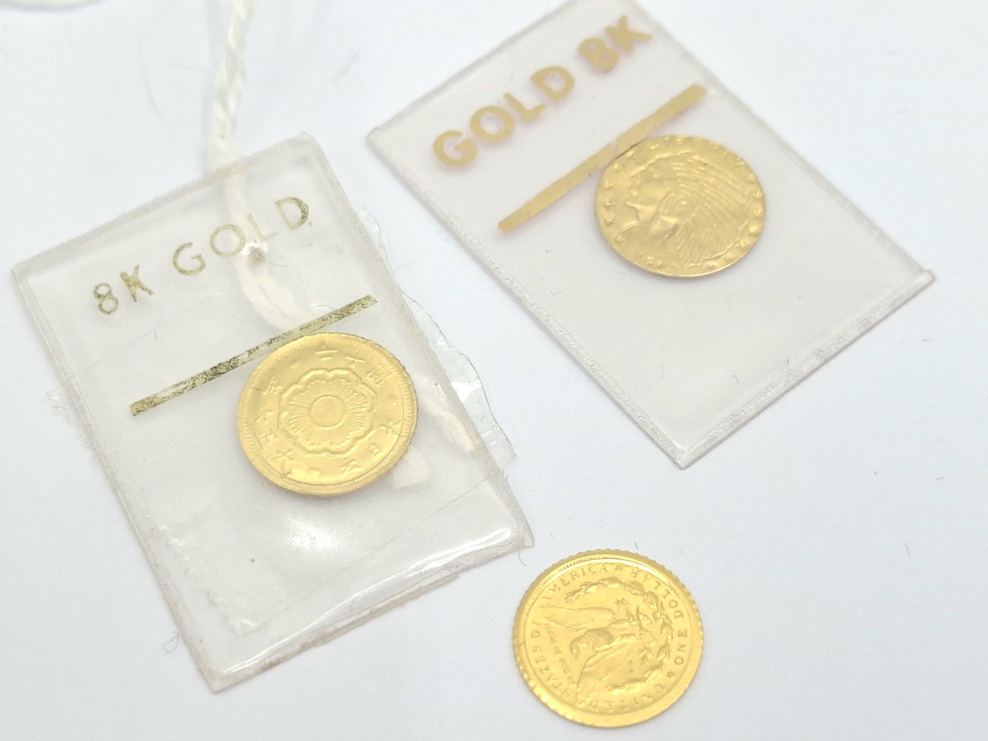 THREE MINIATURE COINS