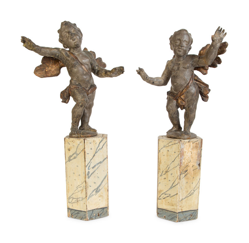 A Pair of Italian Carved Putti on Painted Faux-Marble Bases
Height overall 22 inches.