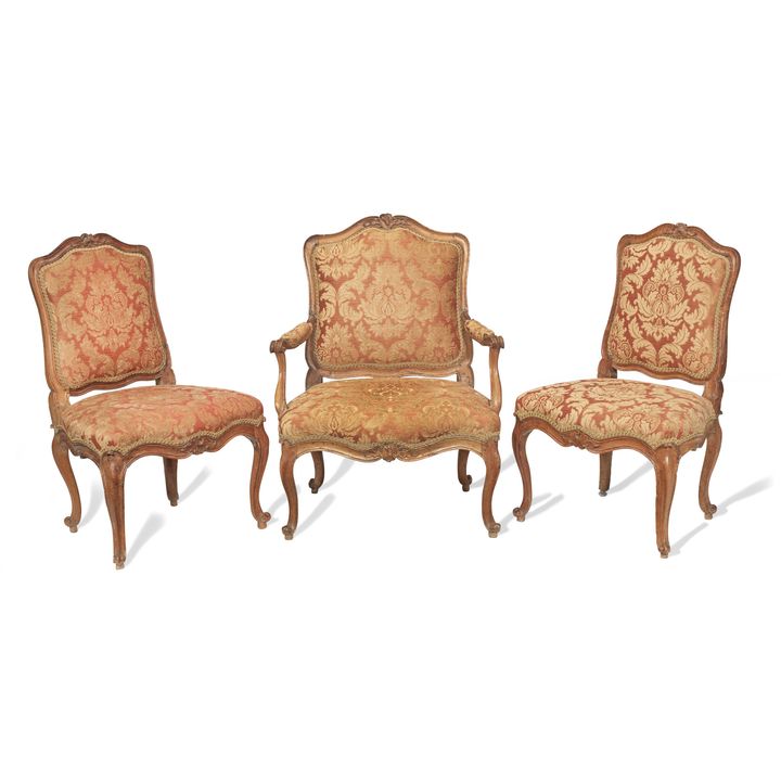 A Louis XV walnut fauteuil and pair of chaises