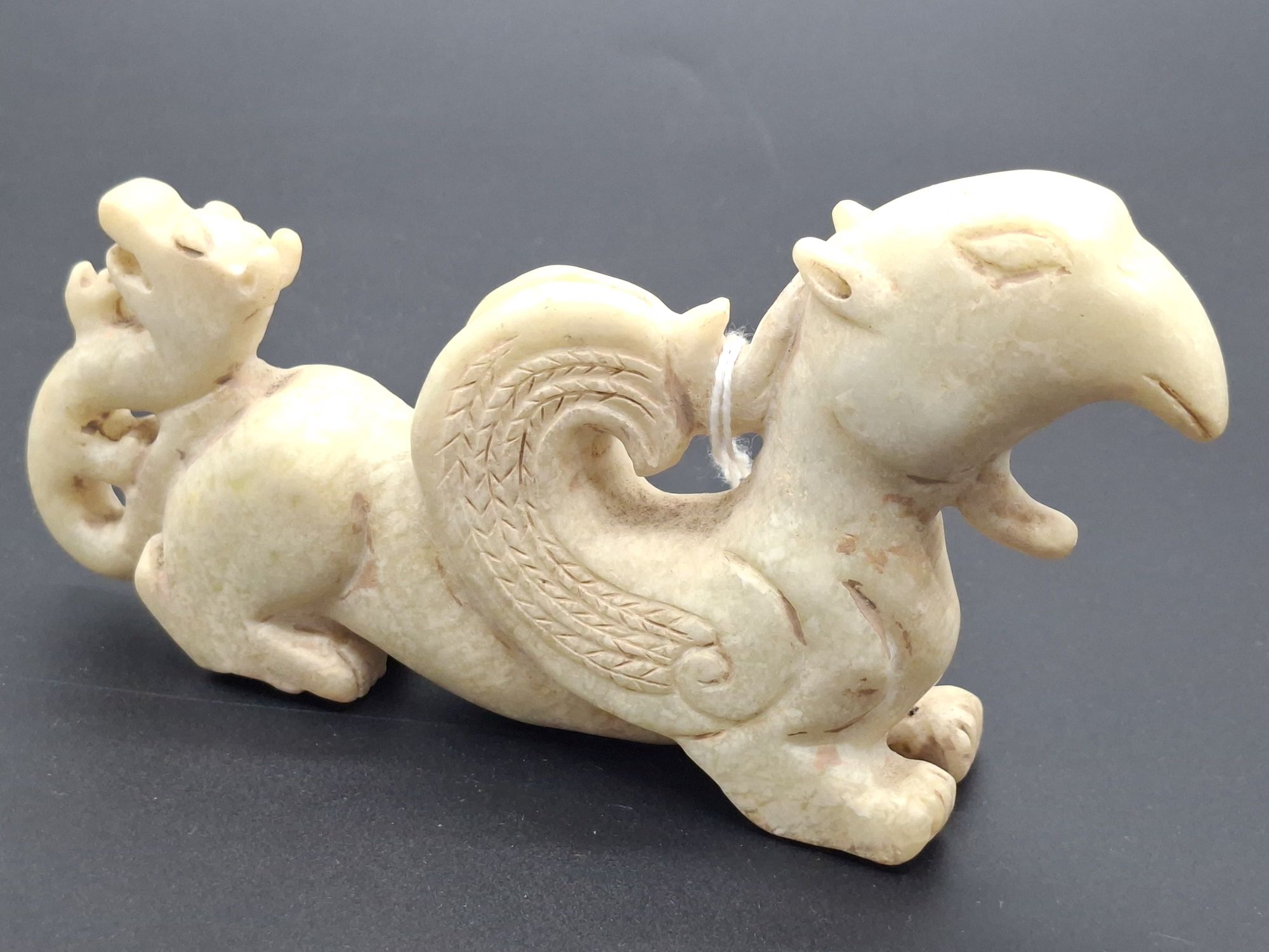 102 · ARCHAIC STYLE CHINESE JADE STATUE