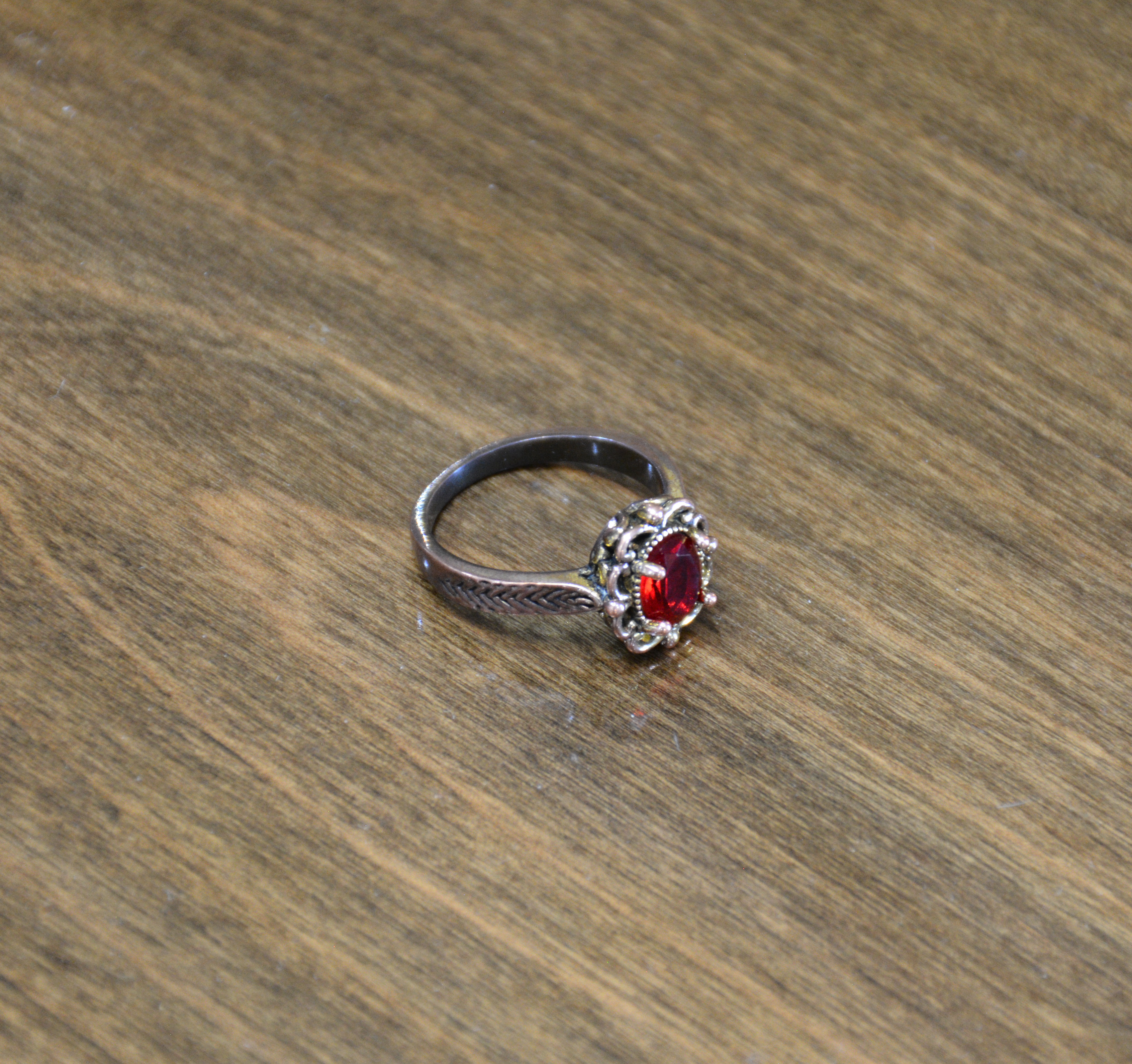 Copper Coloured Ring with Red Stone — NZ auction result