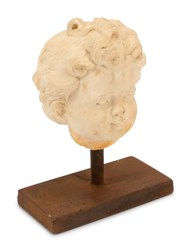An Italian Carved Marble Head of a Youth
Height overall 10 1/2 x width of base 8 x depth 6 inches.