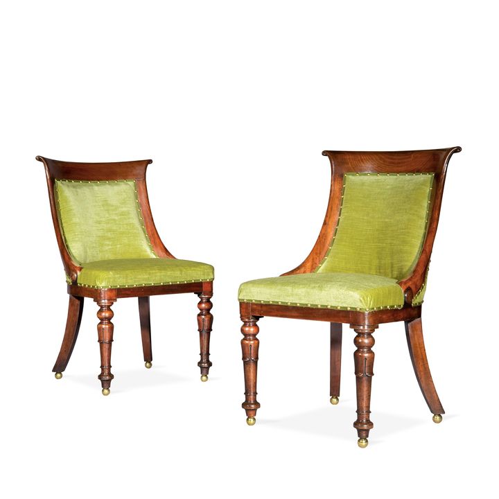 A pair of Regency mahogany bergere side chairs in the manner of Gillows