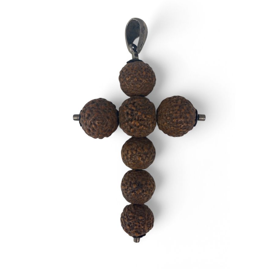 A late 19th/ early 20th century Indian Tangani Rudraksha seed and white metal crucifix