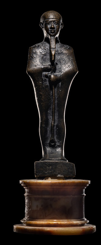 An Egyptian Bronze Ptah
Height 7 inches (18 cm).