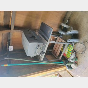 Portable gas grill, typewriter table and misc. in corner