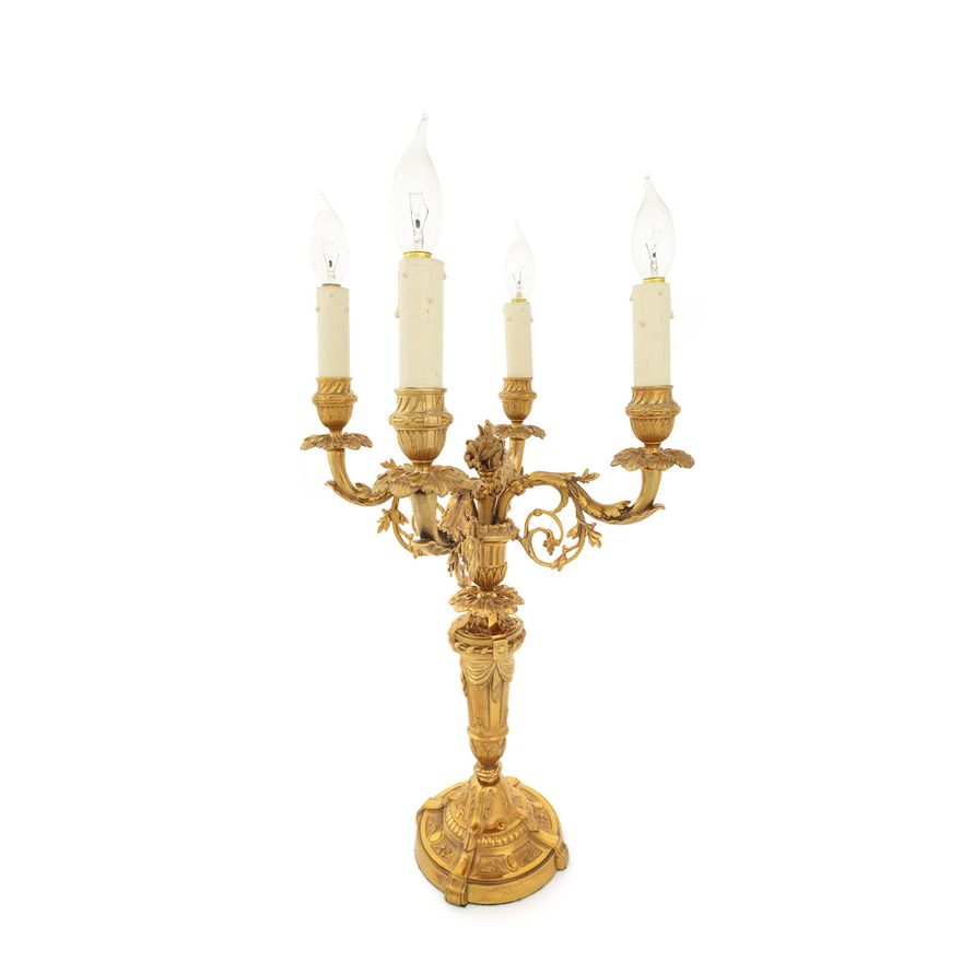 A late 19th century Louis XVI style gilt bronze four light candelabra