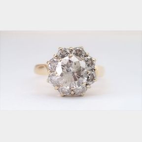 18CT YELLOW GOLD RING WITH 1.173CT CENTRE L I2 + .600CT SMALLS 4.14G - 51611/57