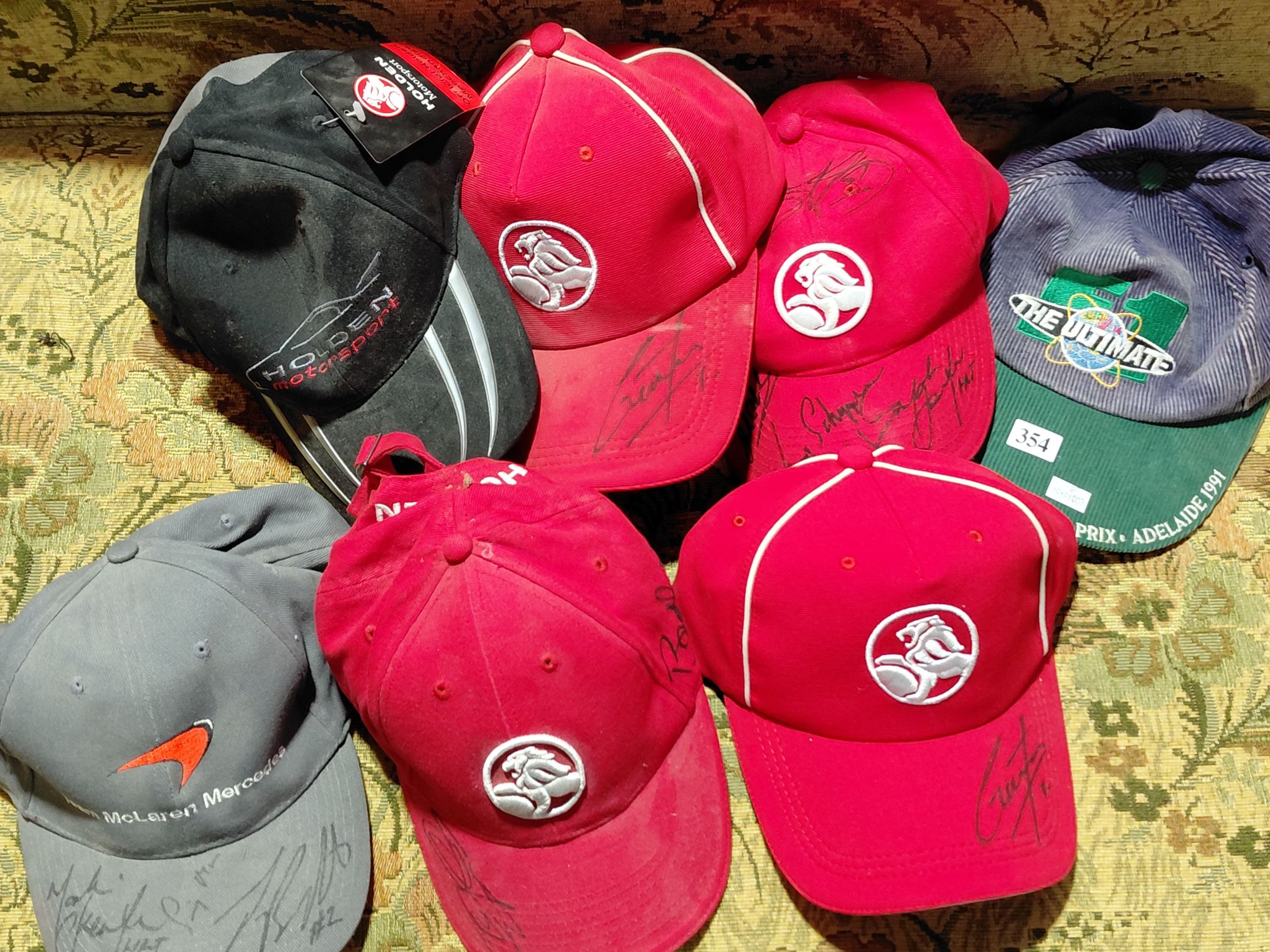 354 · SIGNED MOTOR RACING CAPS