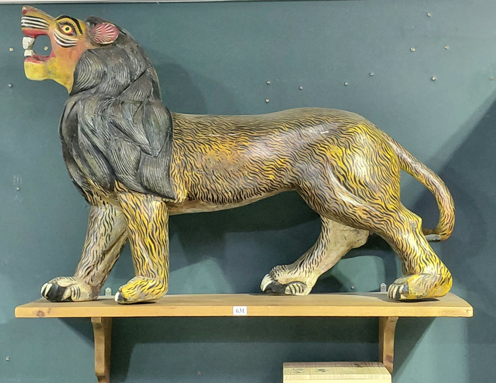 631 · FOLK ART LION SCULPTURE