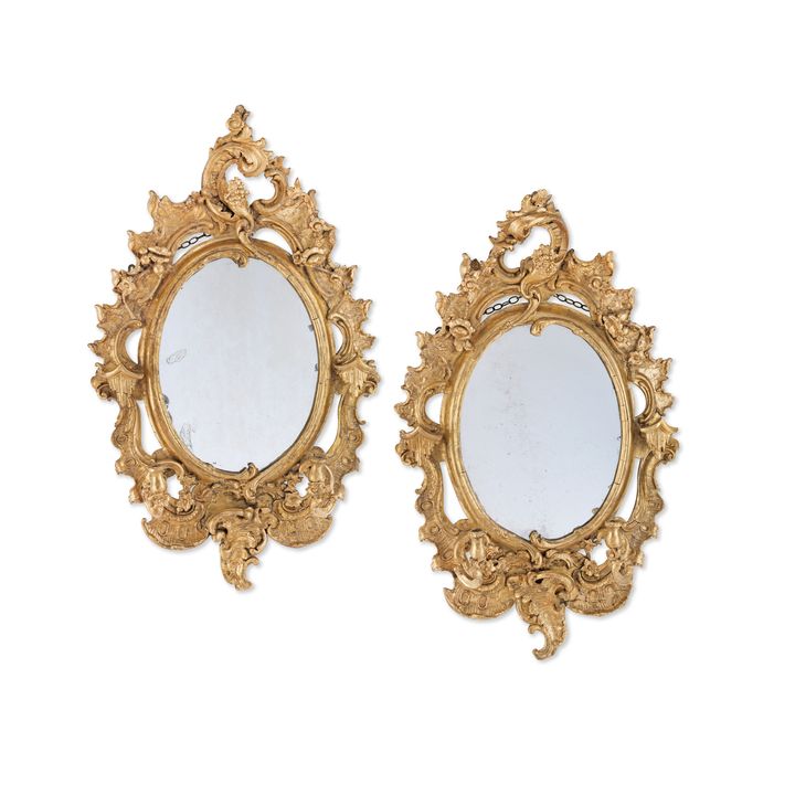 A pair of late 19th / early 20th century carved giltwood and composition girandoles