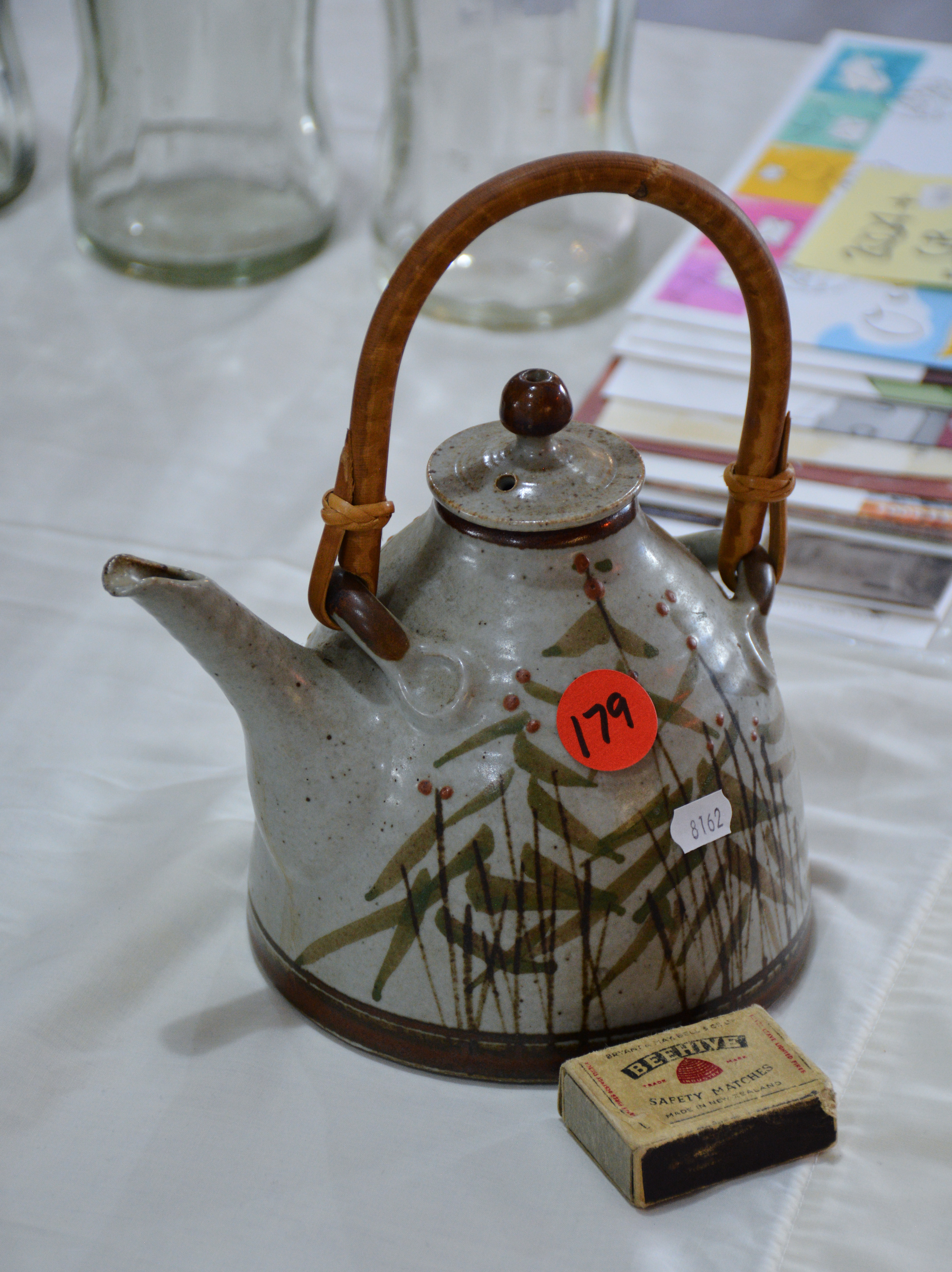 Ceramic Teapot with Cane Handle — sold at auction in New Zealand for $20