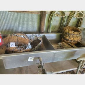 Various hanging flower pot baskets and other gardening items