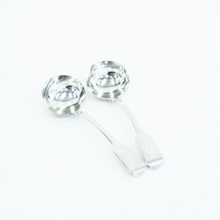 A pair of silver Fiddle pattern sauce ladles