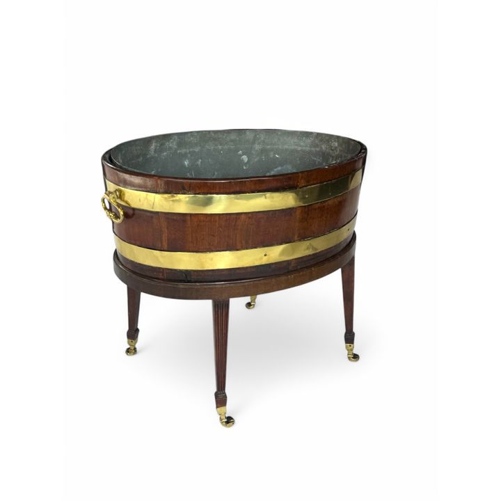 A George III mahogany and brass bound wine cooler on later stand