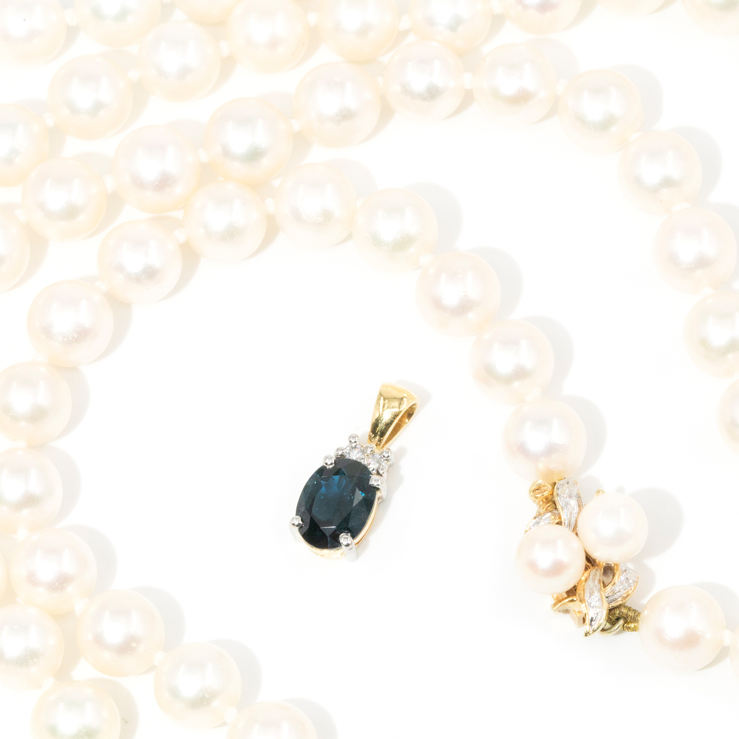 Strand of Pearls and Sapphire and Diamond Pendant