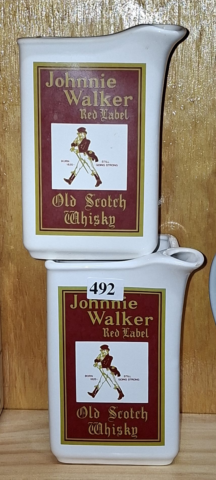 A PAIR OF ELISCHER JOHNNIE WALKER JUGS