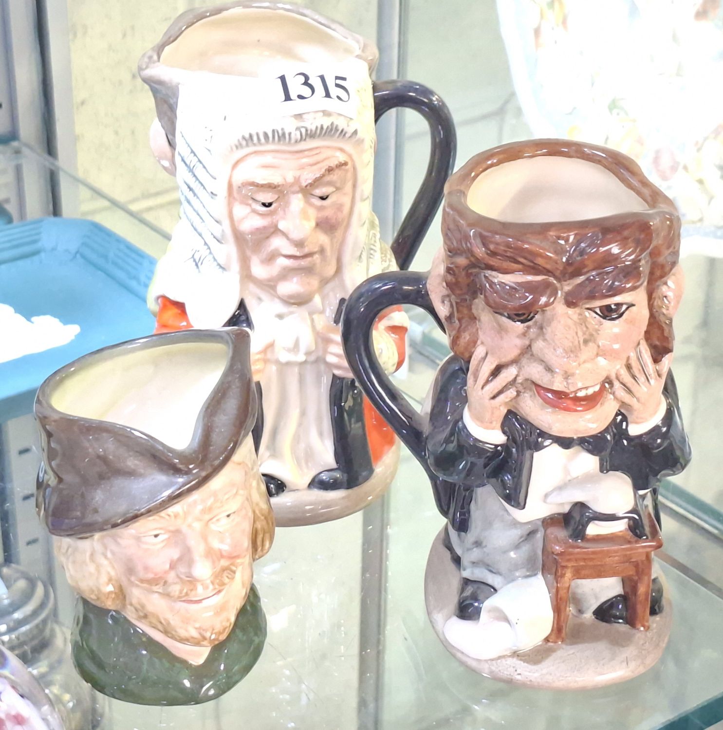 1315 · THREE TOBY JUGS