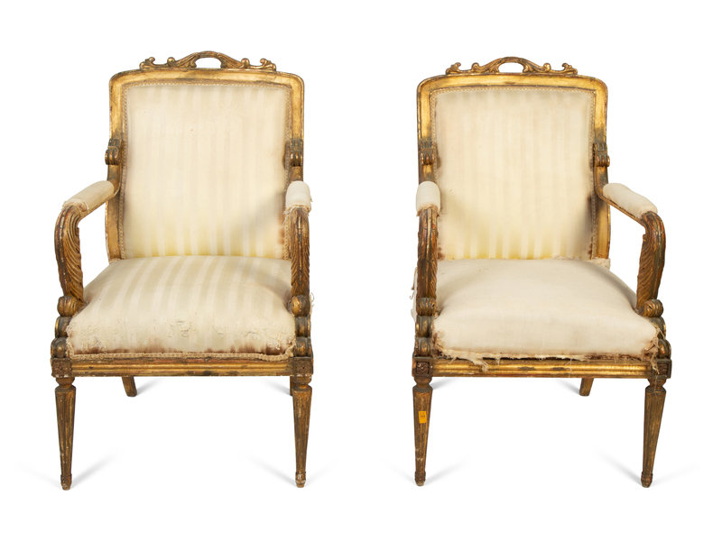 A Pair of Italian Directoire Style Painted and Parcel Gilt Fauteuils
Height 39 x width 24 1/2 x depth 27 inches.
