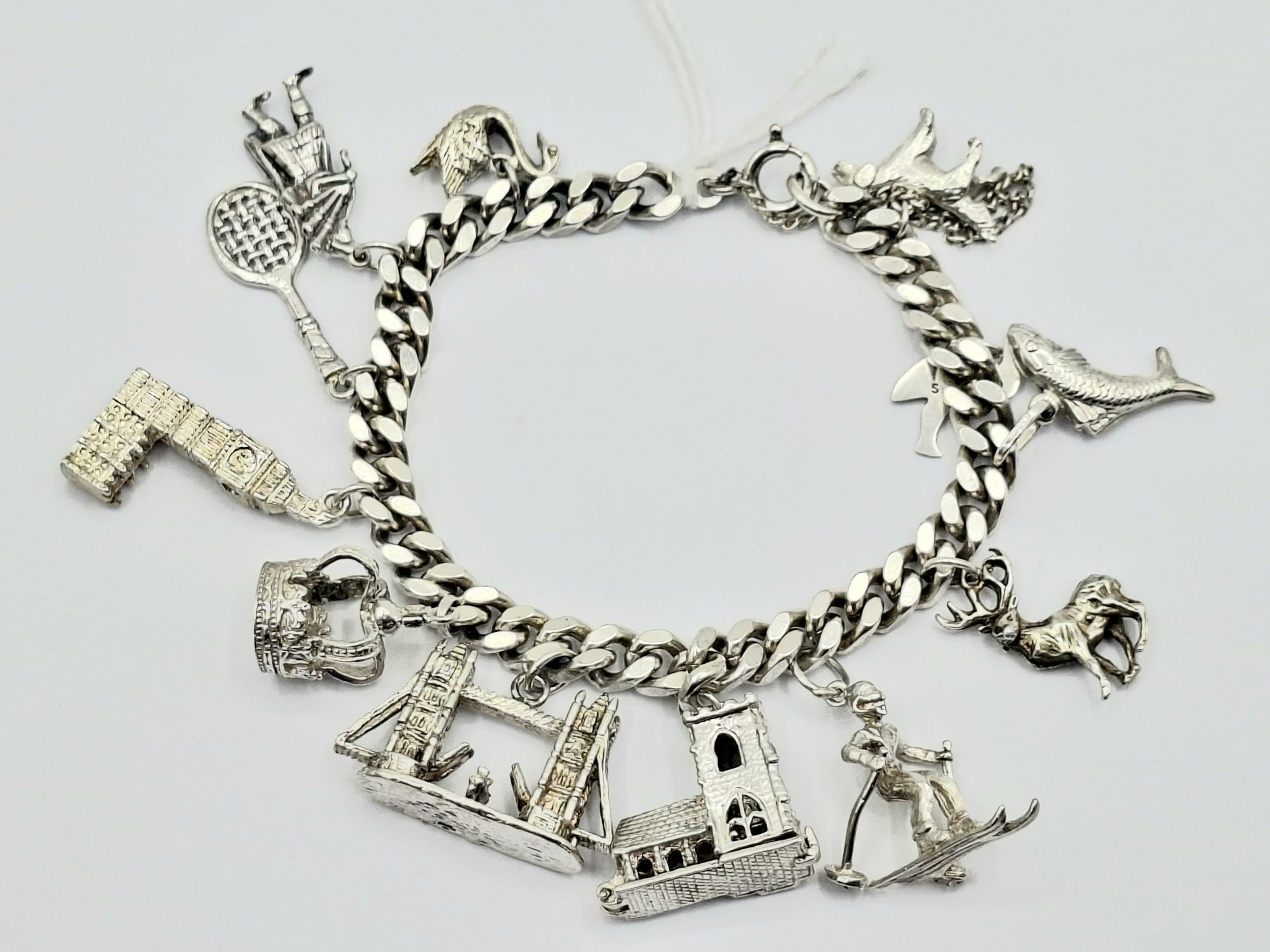 300 · SUBSTANTIAL STERLING SILVER CHARM BRACELET