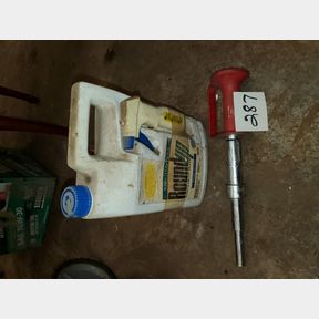 Concrete gun and new gallon of premixed roundup