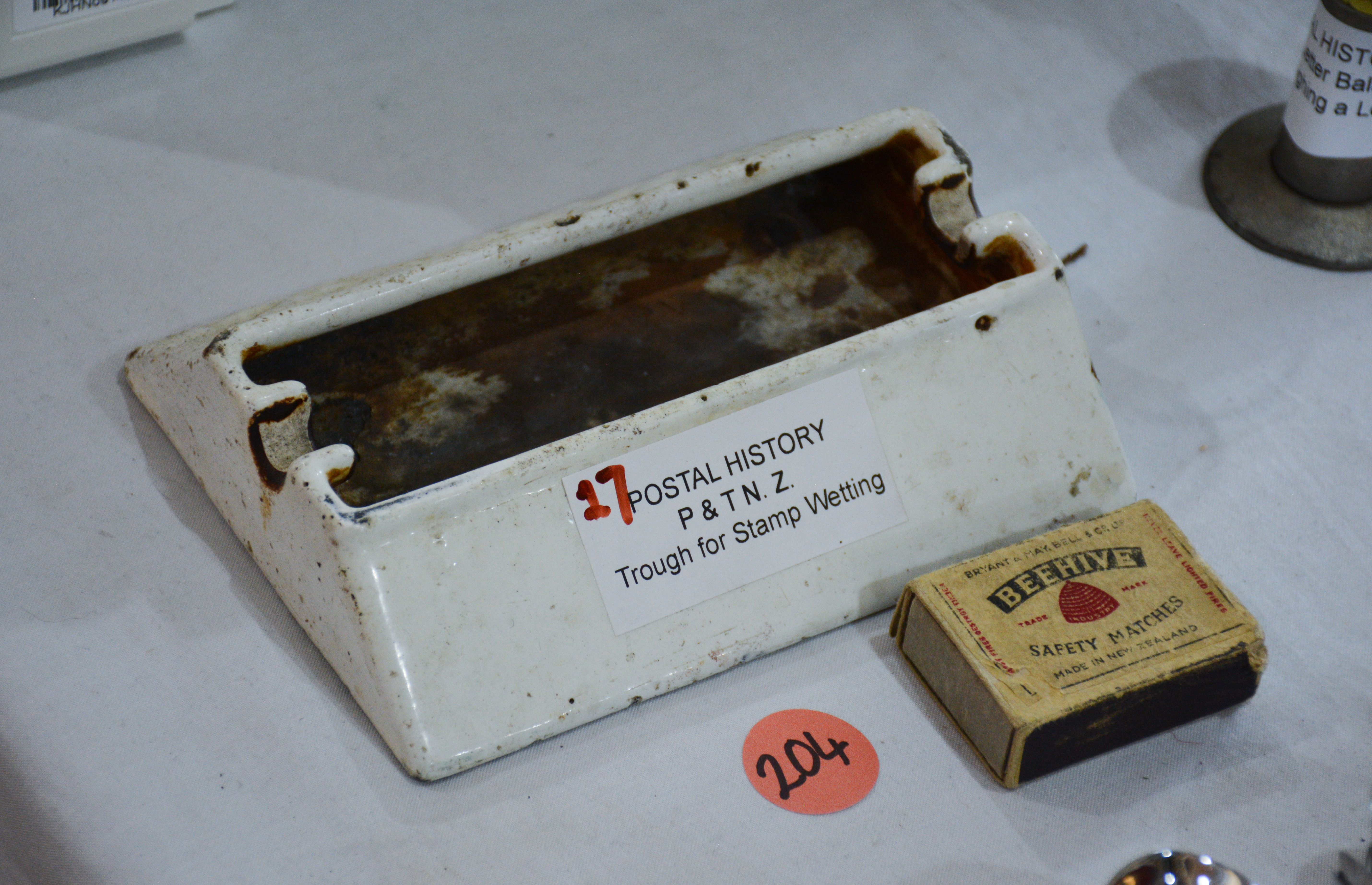 Postal History P+T NZ - Trough for Stamp Wetting — NZ auction result