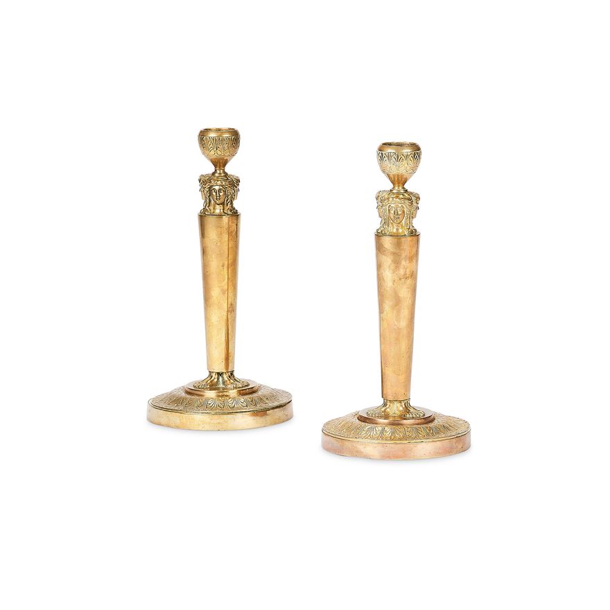 A pair of 19th century French Empire ormolu candlesticks