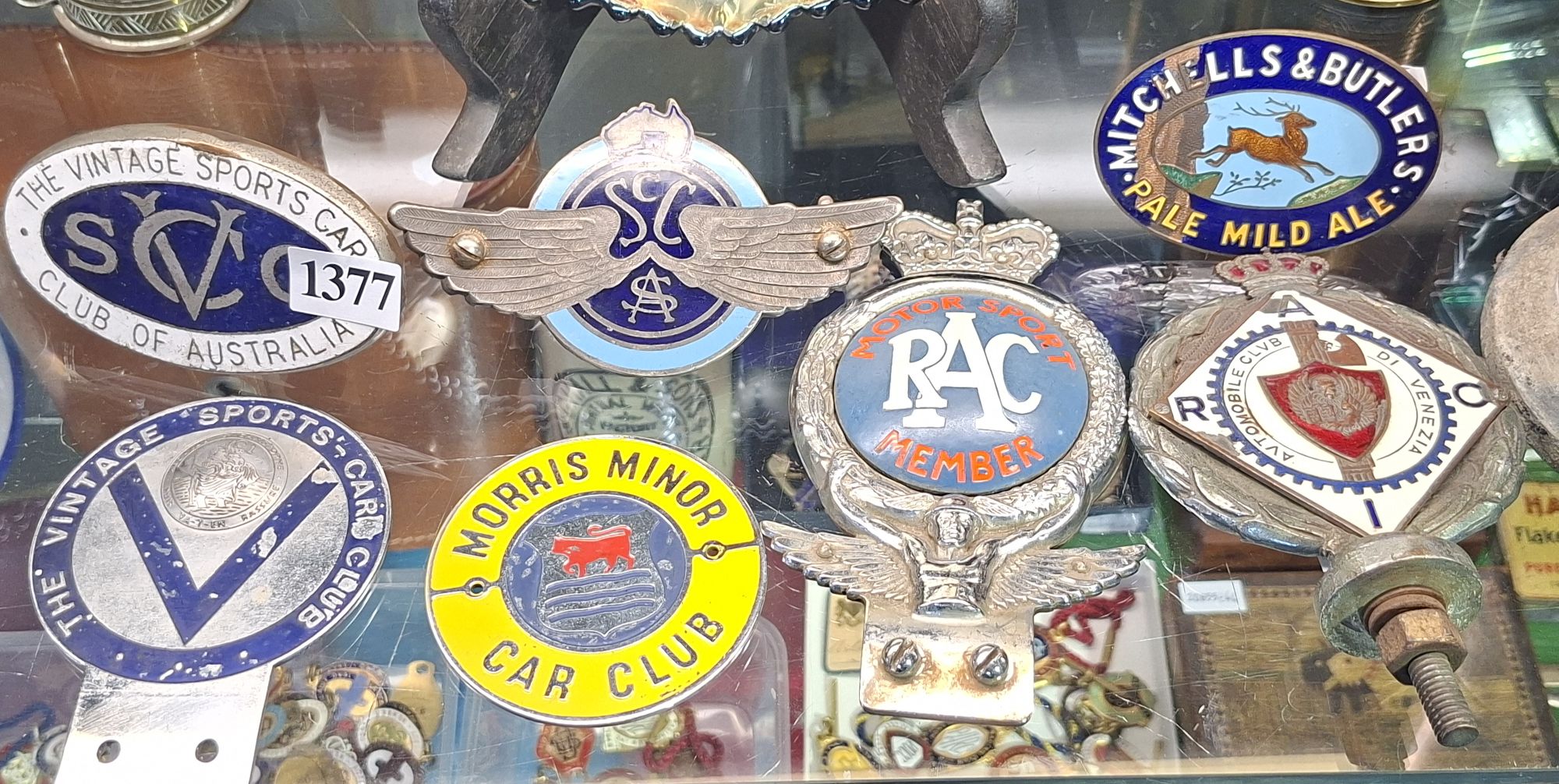 1377 · ENAMEL GRILLE BADGE