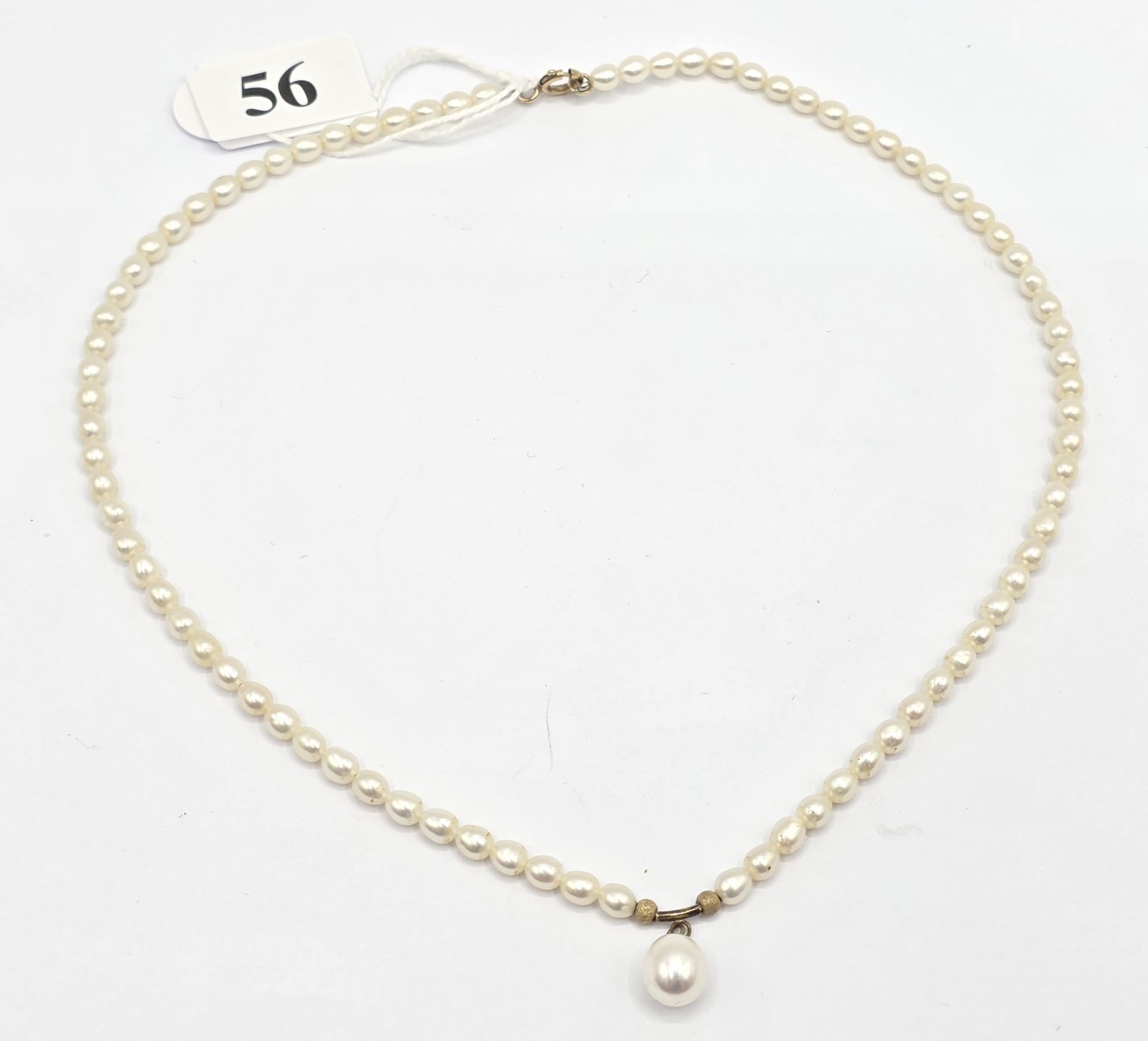 56 · 9CT GOLD AND PEARL NECKLACE