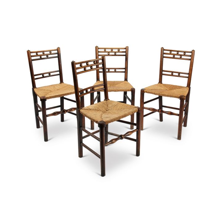 A set of four 19th century elm and ash rush seat chairs