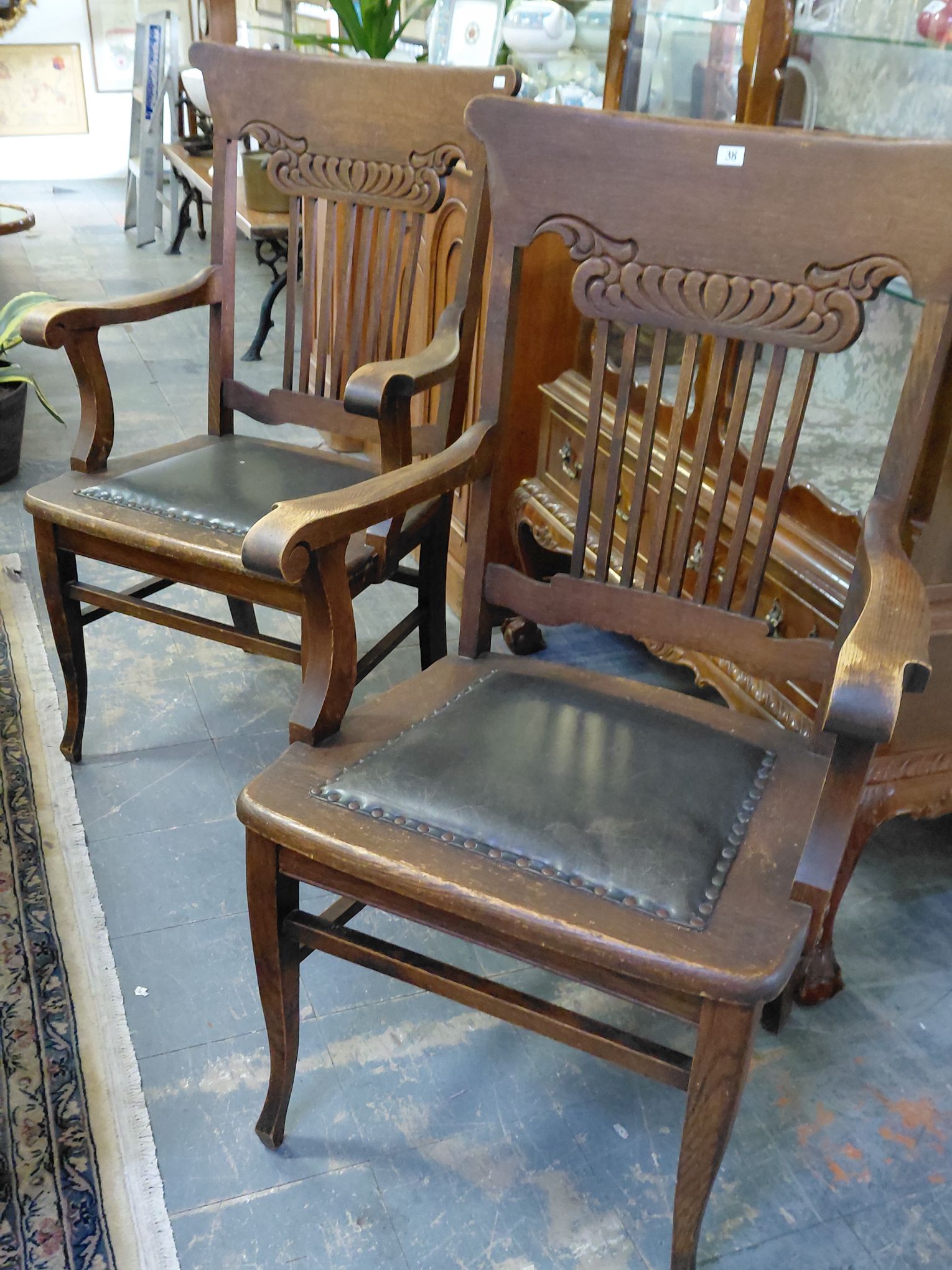 38 · A PAIR OF CARVER CHAIRS