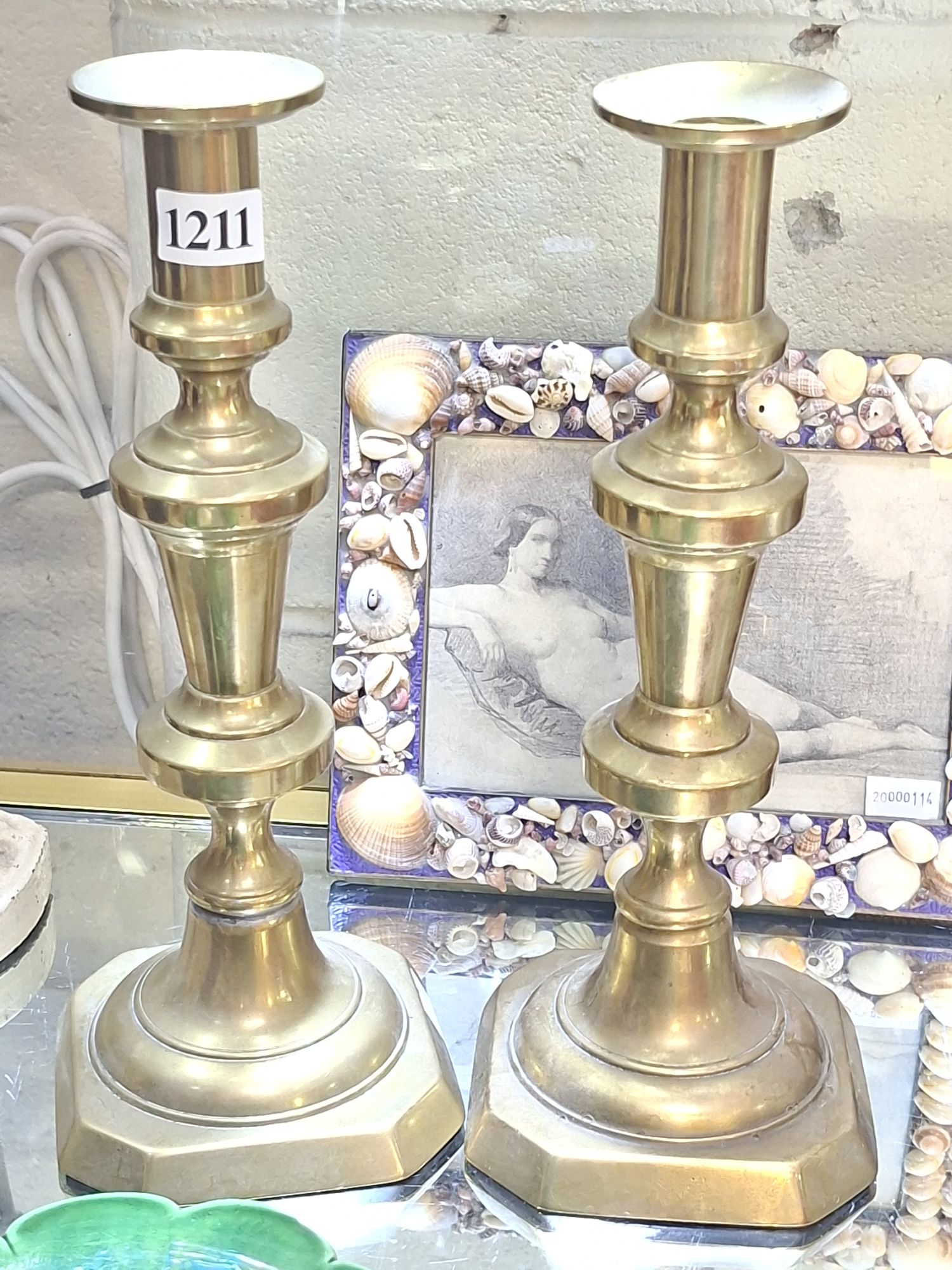 A Pair Of Brass Candlesticks