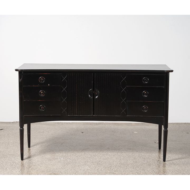 A 1940s ebony sideboard