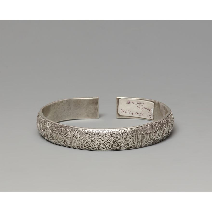 A silver open armband. Around 1900