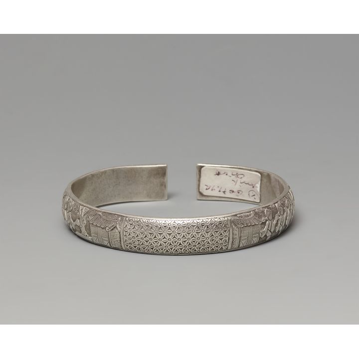 A silver open armband. Around 1900