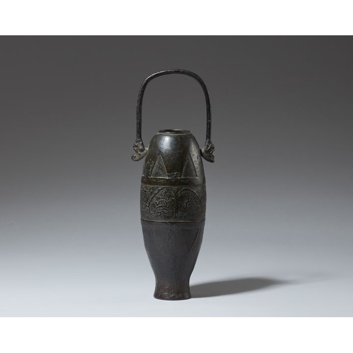 A slender bronze vase with moveable handle. Qing dynasty or earlier
