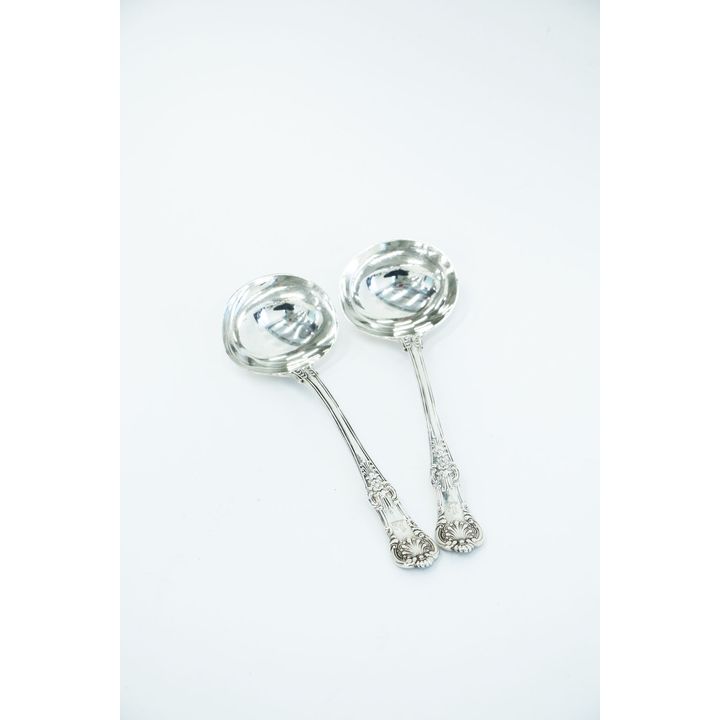 A pair of silver Kings pattern sauce ladles