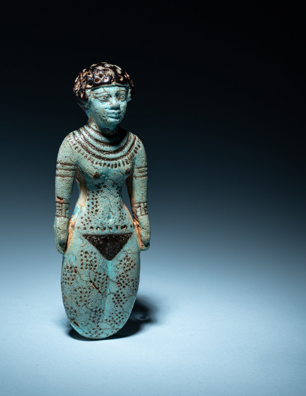 An Egyptian Faience Female Figure
Height 5 1/8 inches (13.02 cm).