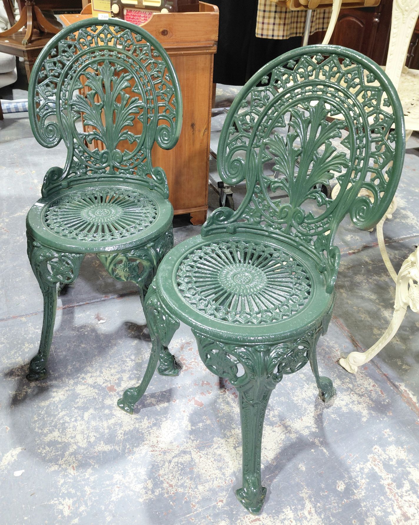 210 · 2 CAST IRON GARDEN CHAIRS