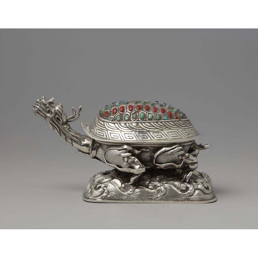 A silver box in shape of a dragon turtle