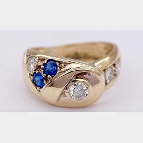 BEAUTIFUL LADIES SAPPHIRE AND DIAMOND FOLD OVER RING SET IN 9CT YELLOW GOLD.0.60CT ESTIMATED DIAMOND WEIGHT .3.7G