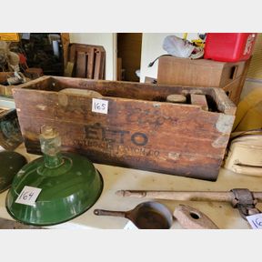 Antique Evinrude Elto boat motor with original crate