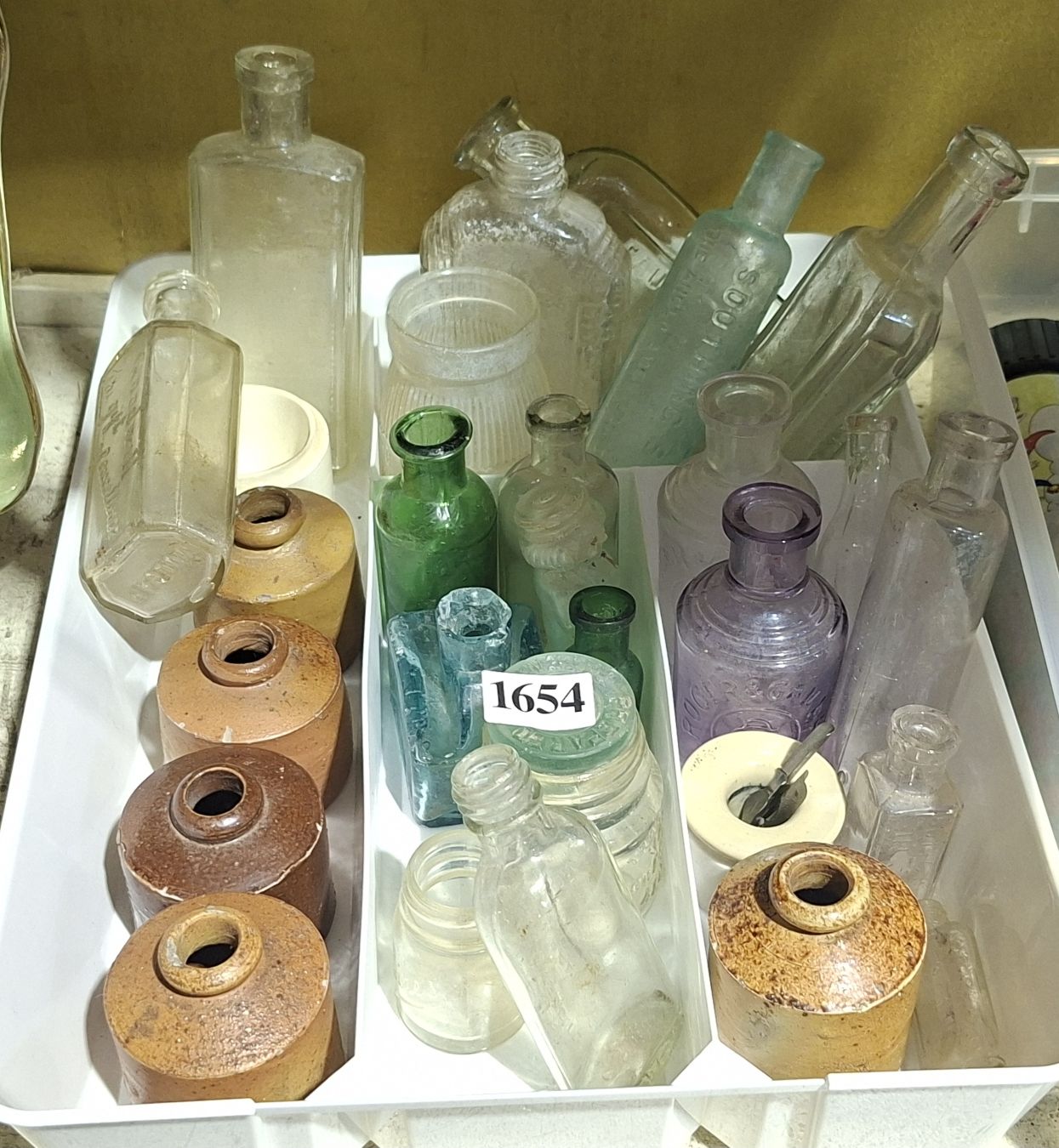 Small Bottles And Stoneware Inkwells