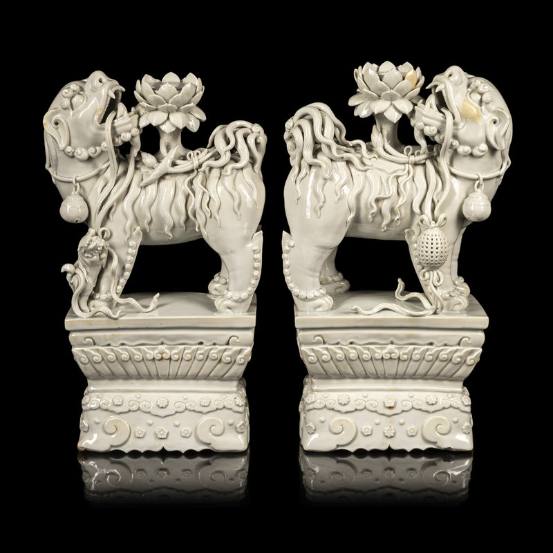 A Pair of Chinese Blanc-de-Chine Figures of Fu Lions
