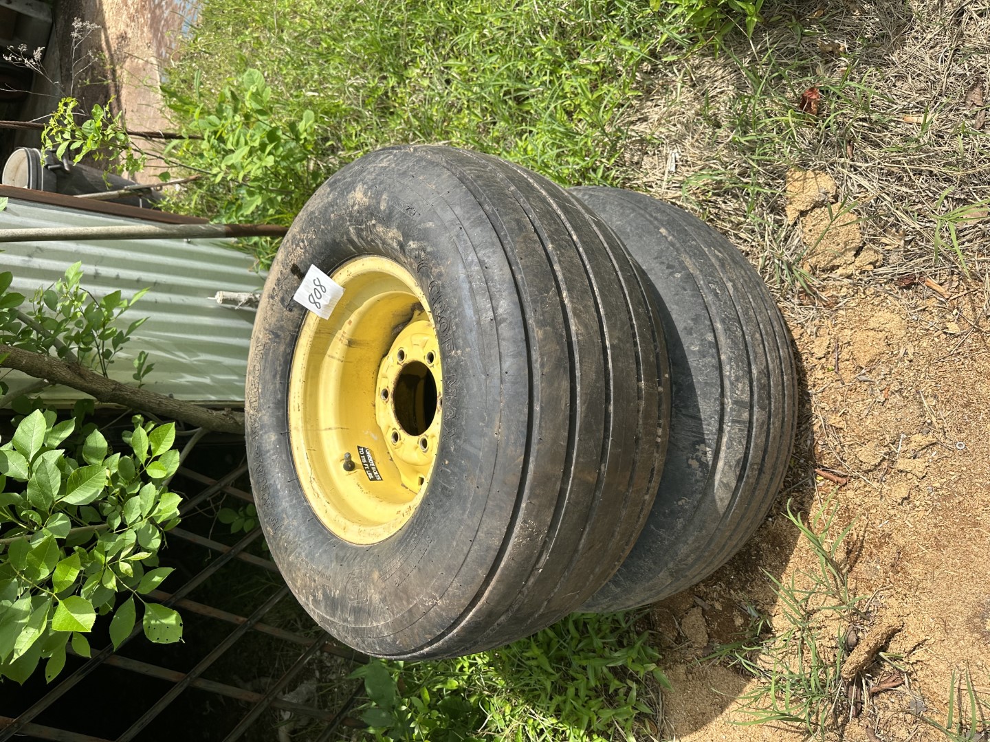 2 Farm wagon wheels and tires Midwest Auctions, LLC