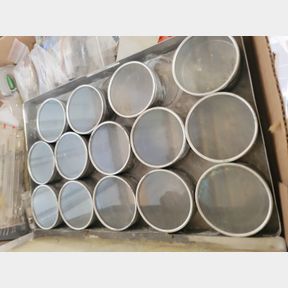 Vintage electronic components and round storage containers